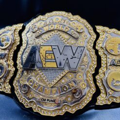 Side plates with detailed designs on the AEW World Championship Replica Belt.
