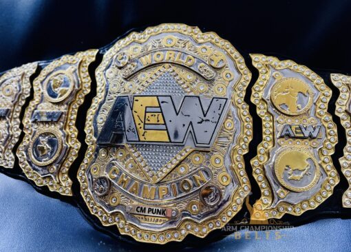 Side plates with detailed designs on the AEW World Championship Replica Belt.