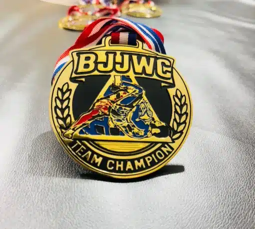 Detailed view of BJJWC team champion medal with HD engraved fighters