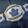 Exact replica of the Toronto Maple Leafs championship belt, showcasing chrome-plated metal plates and intricate design for die-hard hockey enthusiasts.