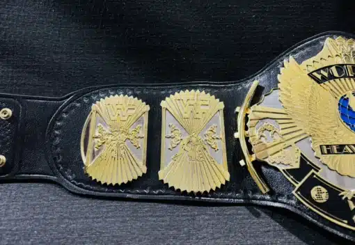 Winged Eagle replica belt featuring shiny gold plating and intricate engraved details.