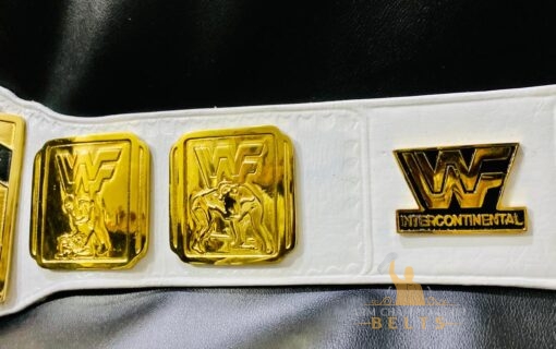 White leather WWE Intercontinental Championship belt with gold plates and embossed logo for collectors