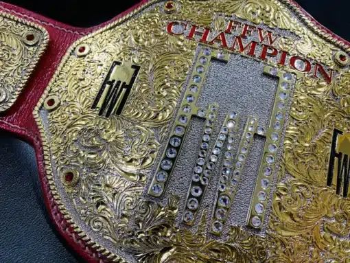 Custom wrestling belt for FFW championships with a bold center plate and personalized side designs.