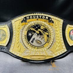 Spinner championship belt designed for law enforcement, showcasing the FBI Houston Field Office emblem.