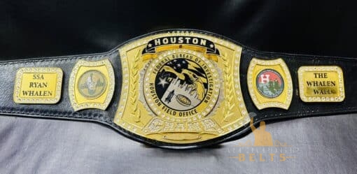 Spinner championship belt designed for law enforcement, showcasing the FBI Houston Field Office emblem.