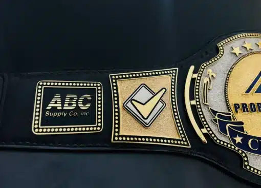 Brass plate championship belt with nugget texture and company branding