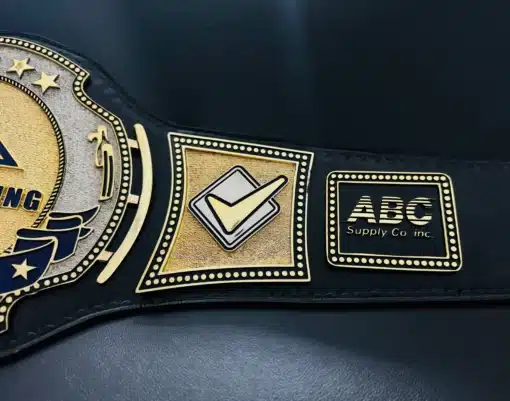 Close-up of custom sales award belt with engraved side plates