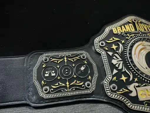 Side plates featuring engraved icons and design details of the Sales Champion Belt.