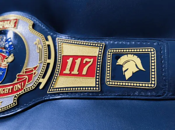Customizable side plates for logos and style on the Navy Wrestling Belt