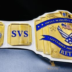 Side view of the Retirement Championship Belt, highlighting the gold plating and intricate design.