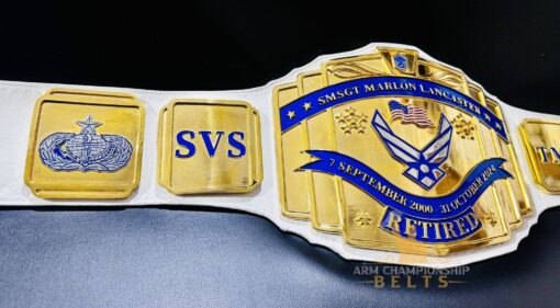 Side view of the Retirement Championship Belt, highlighting the gold plating and intricate design.