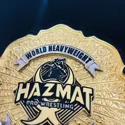 Heavyweight championship belt with deep engraved gold plate and professional wrestling design