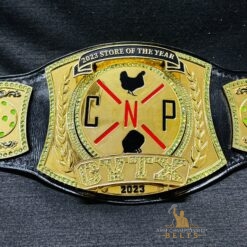 Close-up of the Company Recognition Award championship belt with custom logos and Swarovski gems.