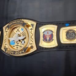 A premium custom military tribute championship belt with engraved designs and military insignias.