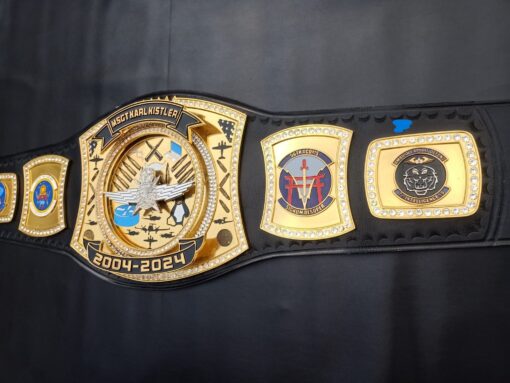 A premium custom military tribute championship belt with engraved designs and military insignias.