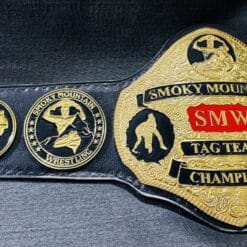 A pristine SMW Tag Team Wrestling Belt, with intricate etching and bold championship symbols representing tag team legacy.