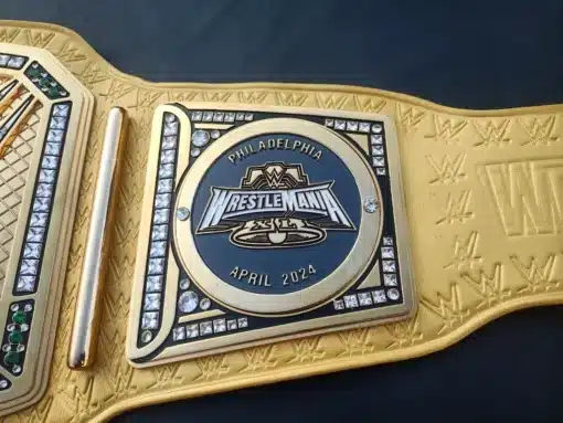 Side plates of the WrestleMania 41 Belt showcasing detailed craftsmanship and premium gold-plated