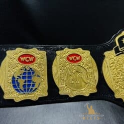 Detailed side plates of the WCW Tag Team Championship Belt with gold-plated finish and iconic WCW engravings.