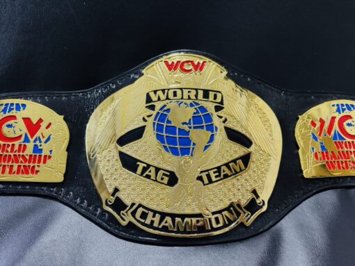 Shiny gold finish on the WCW World Tag Team Championship Belt, capturing authentic look.