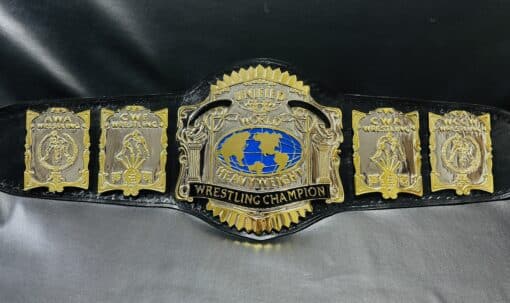 Close-up shot of the Unified USWA World Title Belt detailing its intricate etching and chrome finish.