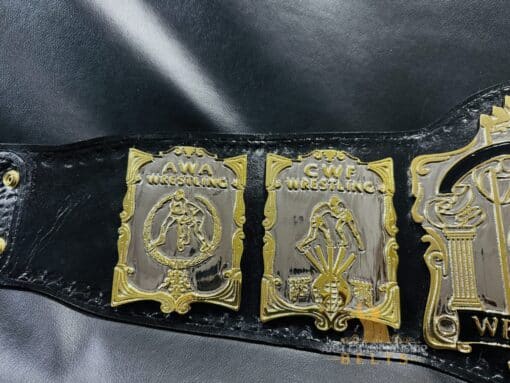 Side profile of the USWA World Title Belt, highlighting its quality craftsmanship and leather strap.