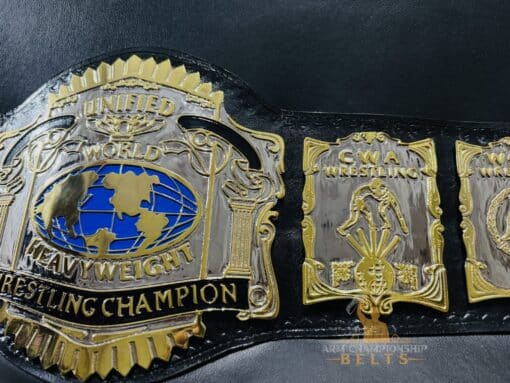 Close-up of the genuine leather strap on the USWA Unified World Title Belt, showcasing its durability.