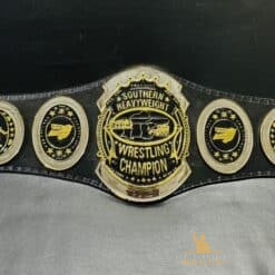 : Front view of the Southern Heavyweight Championship Belt showcasing the deep etching plates and shiny gold finish.