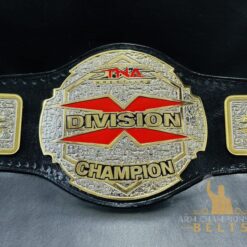 Front view of the TNA X Division Championship Belt showcasing the deep etching plates and shiny gold finish.