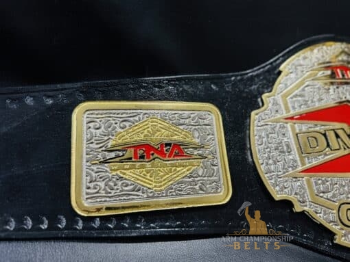 Side profile of the TNA X Division Championship Belt, featuring its elegant design and craftsmanship.