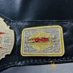 The TNA X Division Championship Belt featuring the official event logo, emphasizing its connection to TNA history.