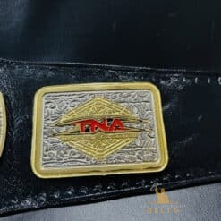 Close-up of the genuine leather strap on the TNA X Division Championship Belt, highlighting its quality and durability.