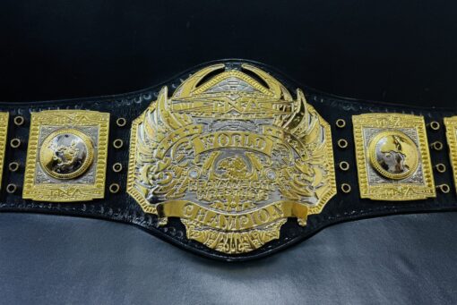 Front view of the TNA World Heavyweight Championship Belt, featuring deep etching plates and a genuine leather strap.