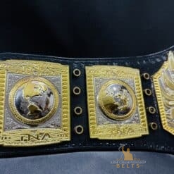 The TNA Championship Belt featuring the official event logo, emphasizing its connection to TNA wrestling history.