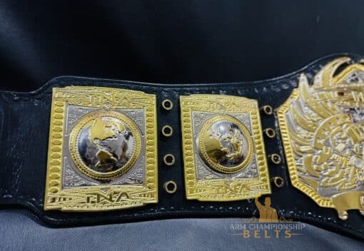 The TNA Championship Belt featuring the official event logo, emphasizing its connection to TNA wrestling history.