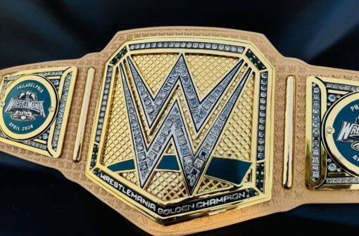 Close-up of the WrestleMania 40 Golden Championship Belt highlighting the detailed Engraving and craftsmanship.