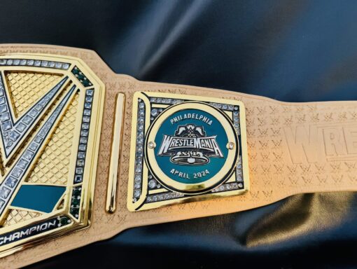 Side view of the WrestleMania 40 Golden Replica Belt displaying its authentic design and elegant profile.