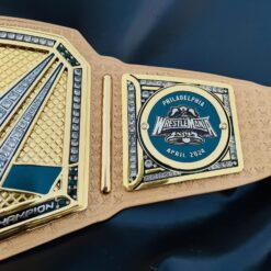 Close-up of the WrestleMania 40 logo on the Golden Championship Belt, showcasing the event's iconic branding.