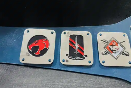 Side plates showcasing custom military logos, insignias, and unit symbols representing US Army and Armed Forces units.