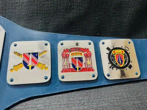 Side plates showcasing custom military logos, insignias, and unit symbols representing US Army and Armed Forces units.