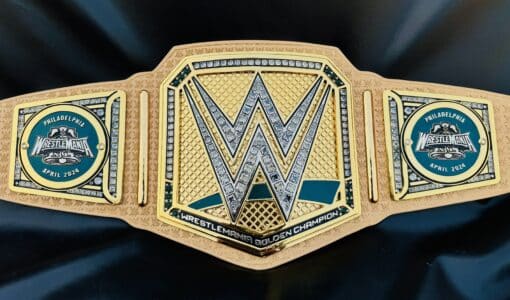 The WrestleMania 40 Golden Championship Belt captured in natural light, accentuating its shine and color.