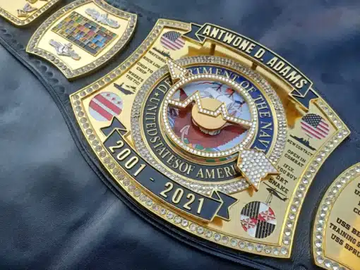 Unique design elements of the custom military retirement belt with gold and crystal accents.