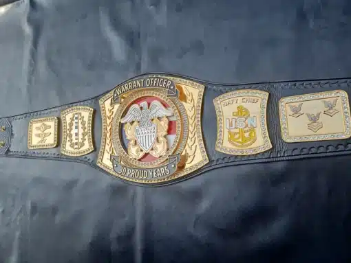 Full view of the Warrant Officer Championship Belt with leather strap and gold plates.