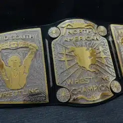 Close-up image of the deeply engraved center plate of the Mid South North American Heavyweight Championship Belt.