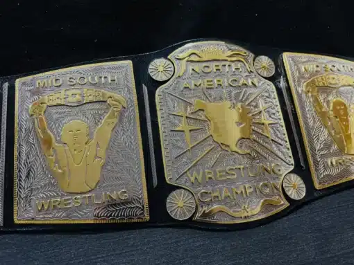 Close-up image of the deeply engraved center plate of the Mid South North American Heavyweight Championship Belt.