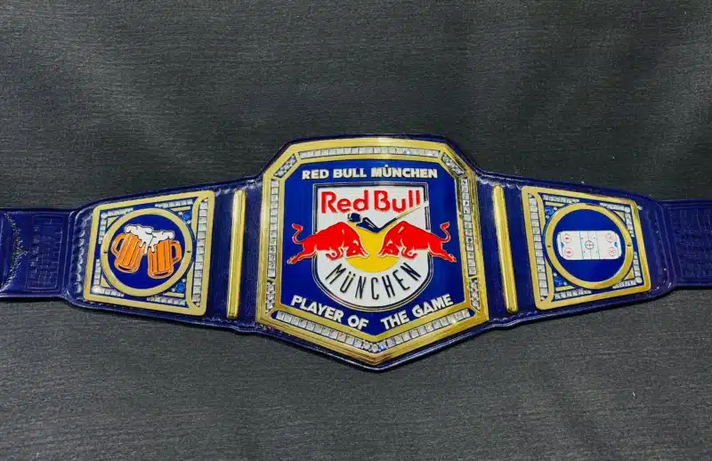 Custom Red Bull München championship belt featuring a TV-accurate WWE-style design with a Red Bull logo centerpiece.