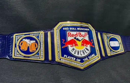 Close-up of the Red Bull logo on the main plate of the custom championship belt with hand-engraved detailing.