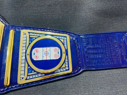 Ice hockey rink design engraved on the side plate of the custom Red Bull championship belt.