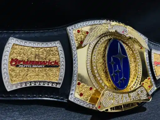 Wrestling belt made with a genuine leather strap, shiny chrome, and gold-plated plates.