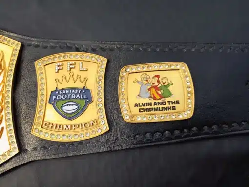 Custom side plates on the Gridiron Glory Spinner Belt, including Alvin and the Chipmunks logo.