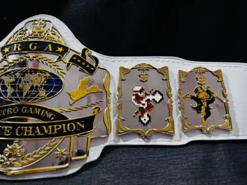 Retro gaming championship belt featuring a luxurious gold-plated finish and deep engraving details.